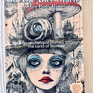May include: A book cover with the title "Go Ask Alice Oracle & Tea Party Game." The cover features an illustration of a woman with blue eye makeup, red lips, and a mushroom. The text "Take an archetypal journey through the Land of Wonder" is also visible.