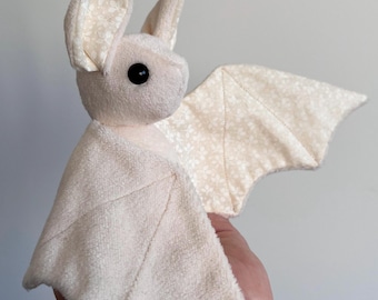 Beige plush bat with white patterns | Bat | Leaves | flower