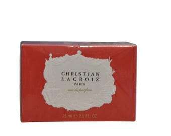 May include: A red box with a white label that says "Christian Lacroix Paris eau de parfum 75 ml e 2.5 FL OZ".