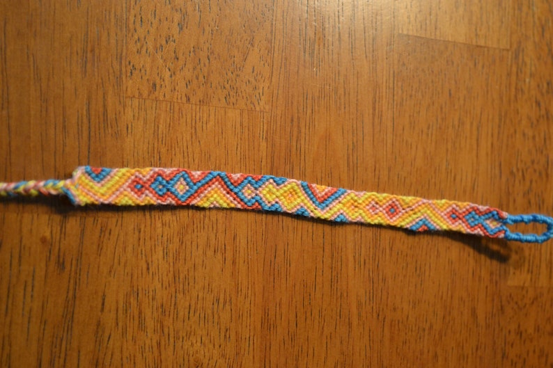 salmon Yellow orange bright blue diamond and triangle pattern handmade woven friendship bracelet