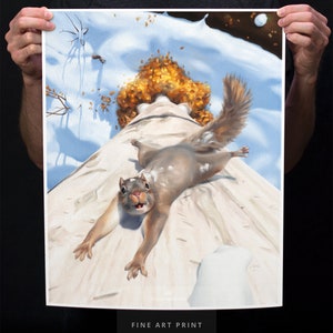 May include: A fine art print of a squirrel on a snowy surface with a pile of autumn leaves in the background. The squirrel is looking directly at the viewer with its mouth open. The print is 16x20 inches.