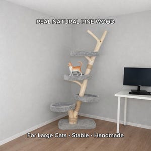 May include: A white ceramic mug with a black handle and the text "But First, Coffee" in a bold, black font. The mug is set against a blurred background, suggesting a cozy setting.