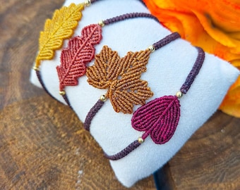 Macramé bracelet featuring autumn leaves in various colours and designs