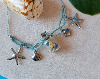 Macrame necklace with glass vials and shell pendants