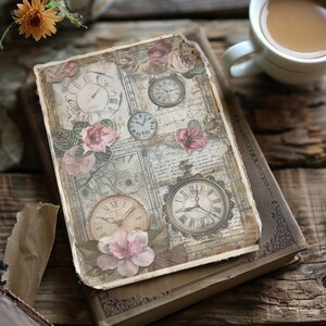 May include: A vintage-style journal with a collage of images, including clocks, flowers, and handwritten text. The journal is closed and lying on a wooden surface.