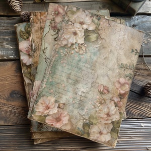 May include: A stack of vintage-style journals with floral designs and handwritten text. The journals have a distressed, aged look and feature delicate lace accents.