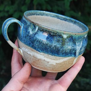 Handmade Matt brown and shiny blue, round stoneware mug.