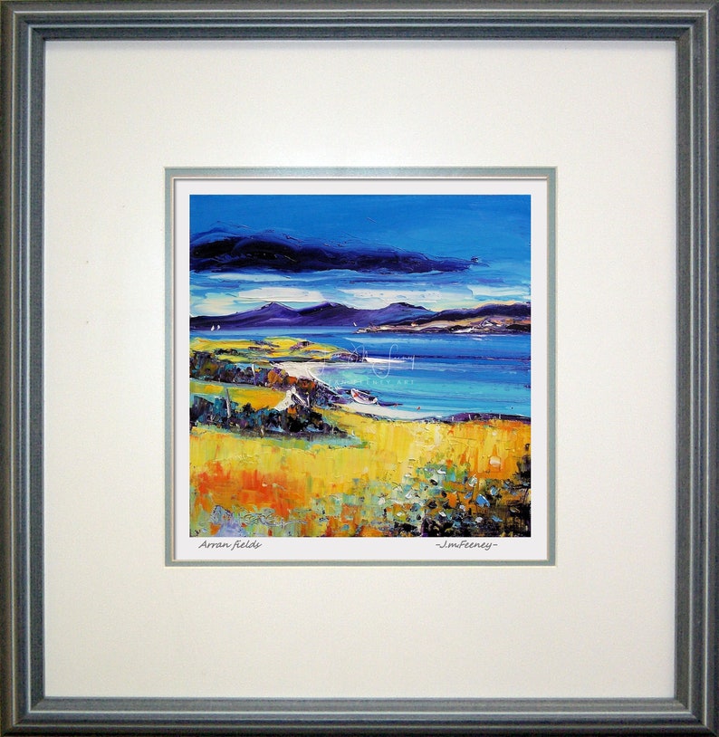 May include: A framed print of a painting depicting a seascape with a blue sky, white clouds, and a body of water. The painting is signed "Jim Fereney" and "Arran, Relais".