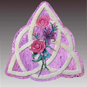 Biodegradable Trinity Knot Urn with flowers. For land or water burial