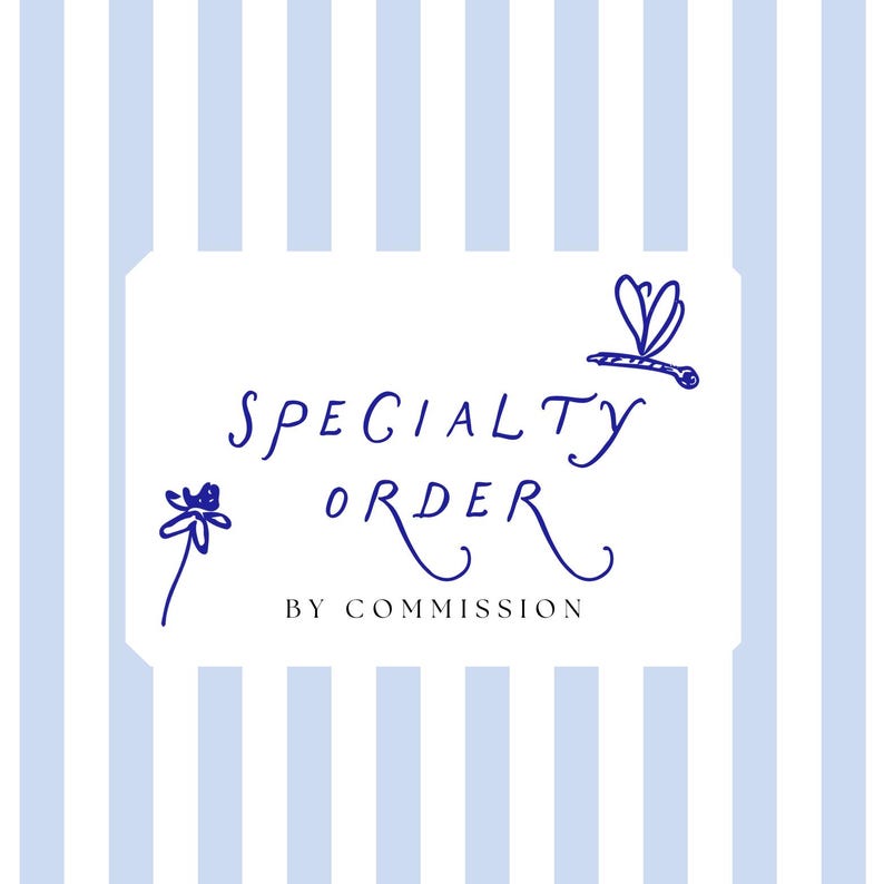May include: A white rectangular sign with the words "SPECIALTY ORDER" in dark blue script, along with a dragonfly and flower illustration. The sign is set against a light blue and white striped background. Text at the bottom reads "BY COMMISSION".