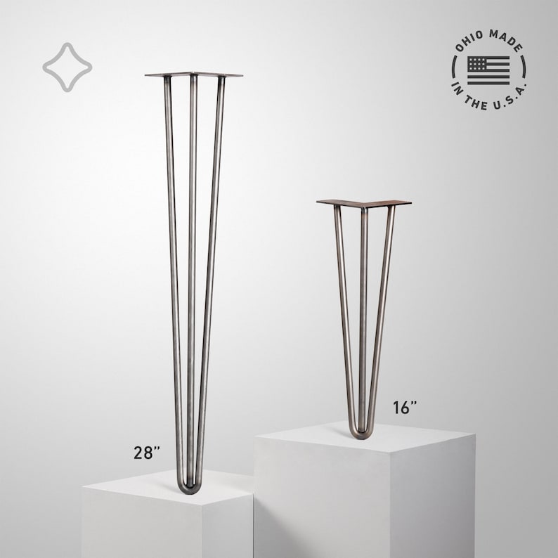 May include: Two metal hairpin table legs. One leg is 28 inches tall, the other is 16 inches tall. The legs are made of metal with a dark, aged finish. The image includes the text "OHIO MADE IN THE U.S.A."