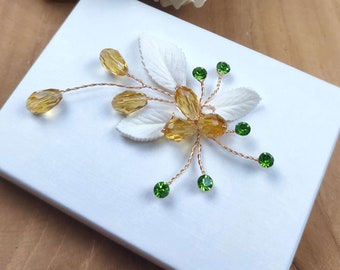 Exotic wedding hair piece with gold crystals, green rhinestones and cold porcelain leaves BJ0021