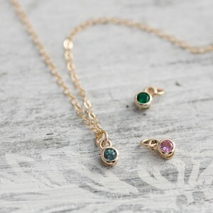 Solid yellow 14k gold birthstone charms on solid yellow gold chain.