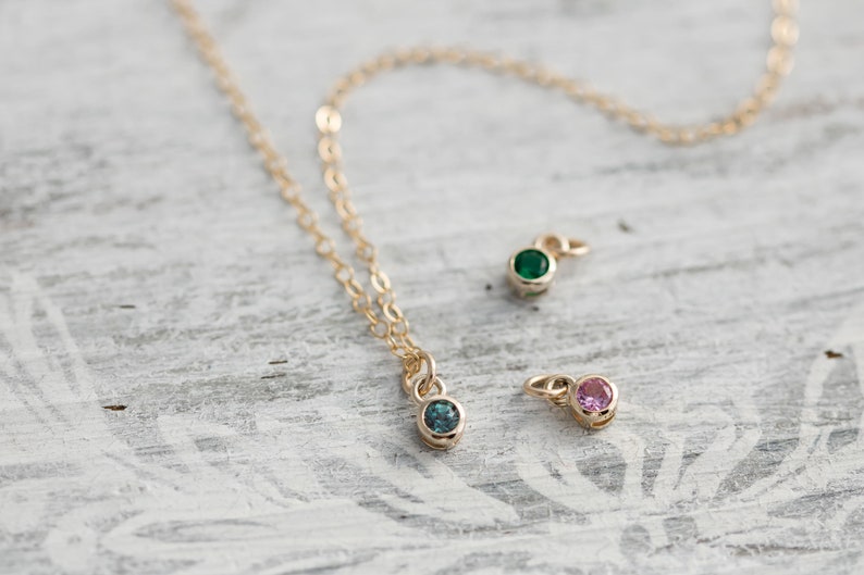 Solid yellow 14k gold birthstone charms on solid yellow gold chain.