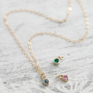 Solid yellow 14k gold birthstone charms on solid yellow gold chain.