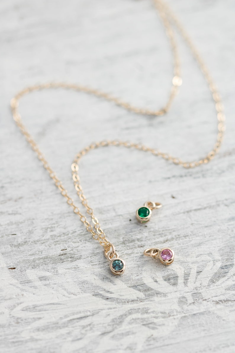 Solid yellow 14k gold birthstone charms on solid yellow gold chain.
