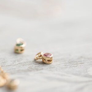 Solid yellow 14k gold birthstone charms on solid yellow gold chain.