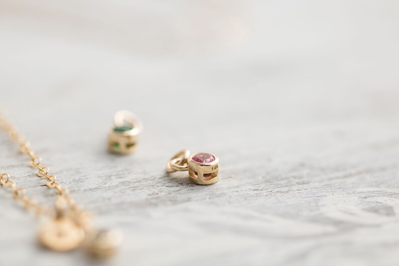 Solid yellow 14k gold birthstone charms on solid yellow gold chain.