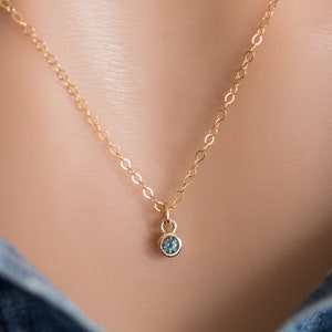 Solid yellow 14k gold birthstone charms on solid yellow gold chain.