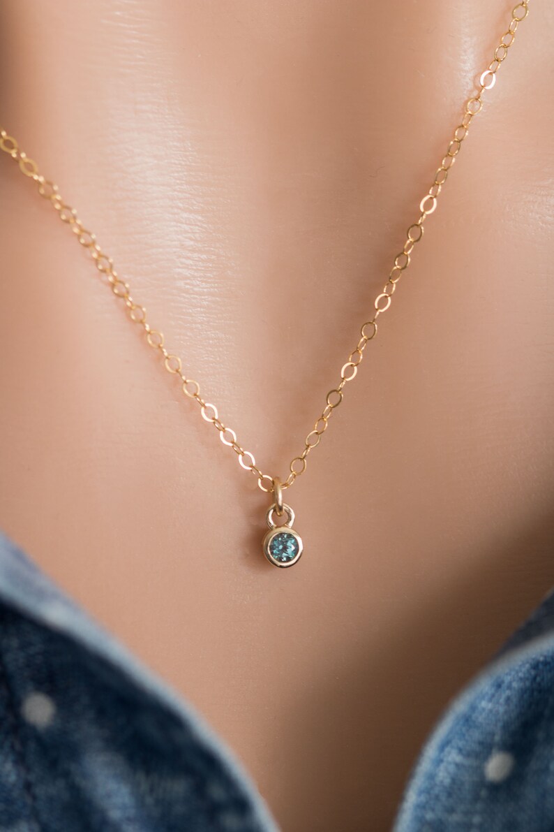 Solid yellow 14k gold birthstone charms on solid yellow gold chain.
