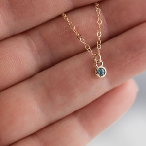 Solid yellow 14k gold birthstone charms on solid yellow gold chain.