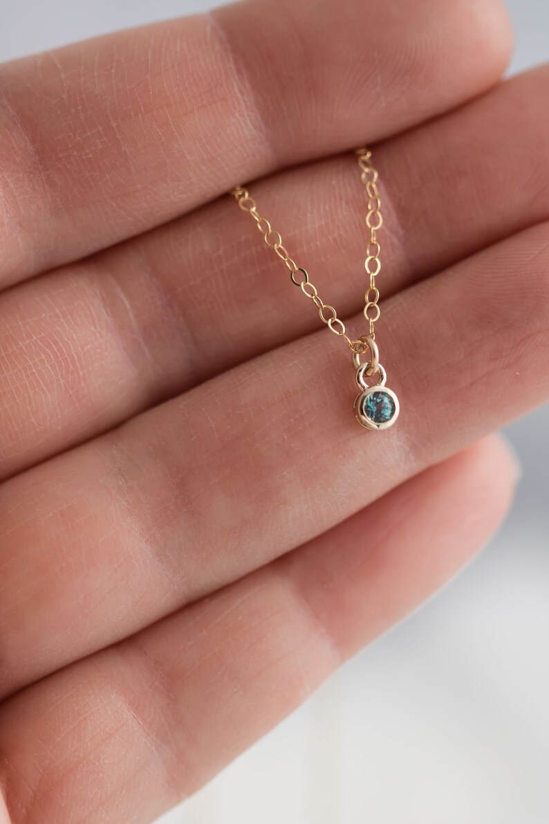 Solid yellow 14k gold birthstone charms on solid yellow gold chain.