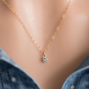 Solid yellow 14k gold birthstone charms on solid yellow gold chain.