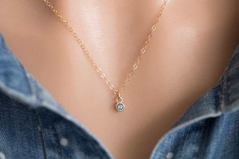 Solid yellow 14k gold birthstone charms on solid yellow gold chain.