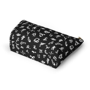 May include: Black zippered pouch with a white pattern of various runes and symbols.