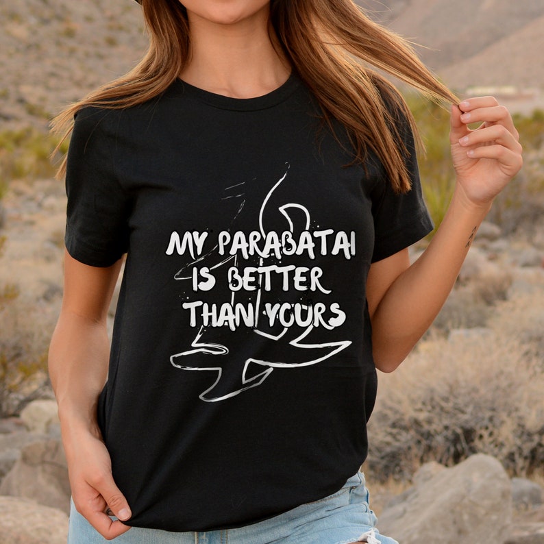 May include: Black t-shirt with white text that reads "My parabatai is better than yours" and a stylized drawing of a rune.