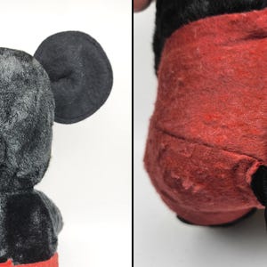 May include: Vintage Mickey Mouse plush toy, featuring black fur, large round ears, and red shorts. The plush has a black tail and is in a seated position. The toy's fur shows signs of wear.