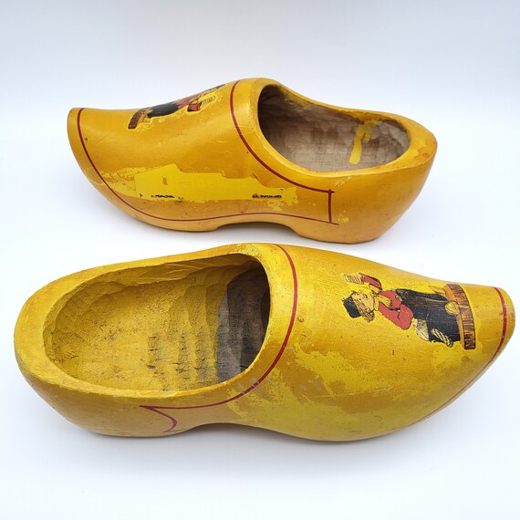yellow wooden clogs