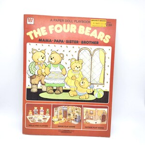 May include: A red paper doll playbook titled The Four Bears Mama Papa Sister Brother. The cover features an illustration of four bears in a room with a window. Below are three smaller panels showing dolls and clothes, an inside play scene, and an outside play scene. A yellow price sticker is attached to the top right corner.