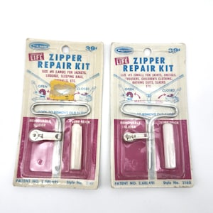 May include: Two vintage Life Zipper Repair Kits on their original packaging. The kits include a tool to remove old slides, a removable slider, and a lube stick. The packaging is white, pink, and blue with text.