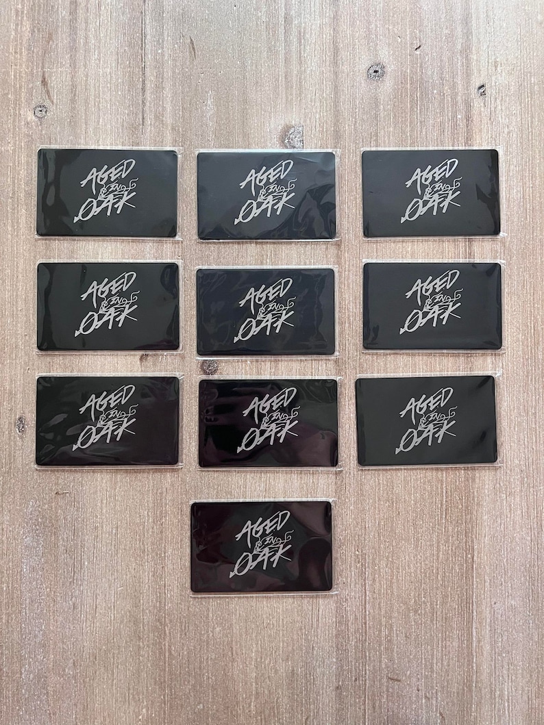 Matte black metal business card with engraved QR code and logo design.
Premium metal networking card for entrepreneurs and professionals.