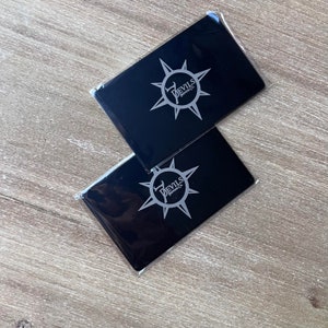 Luxury engraved stainless steel business card in black finish.
