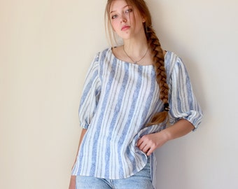 Softened linen blouse with short sleeves and round collar.