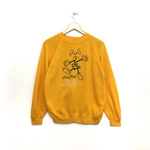 Raro!! Vintage 1988 Haneteru Felpa Jumper Cartoon Colore giallo Taglia media Made in Usa