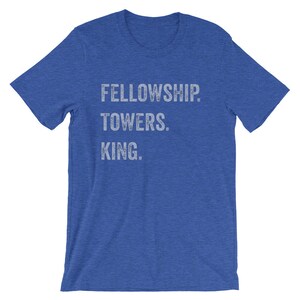 May include: A royal blue t-shirt with the text "FELLOWSHIP. TOWERS. KING." printed in white.