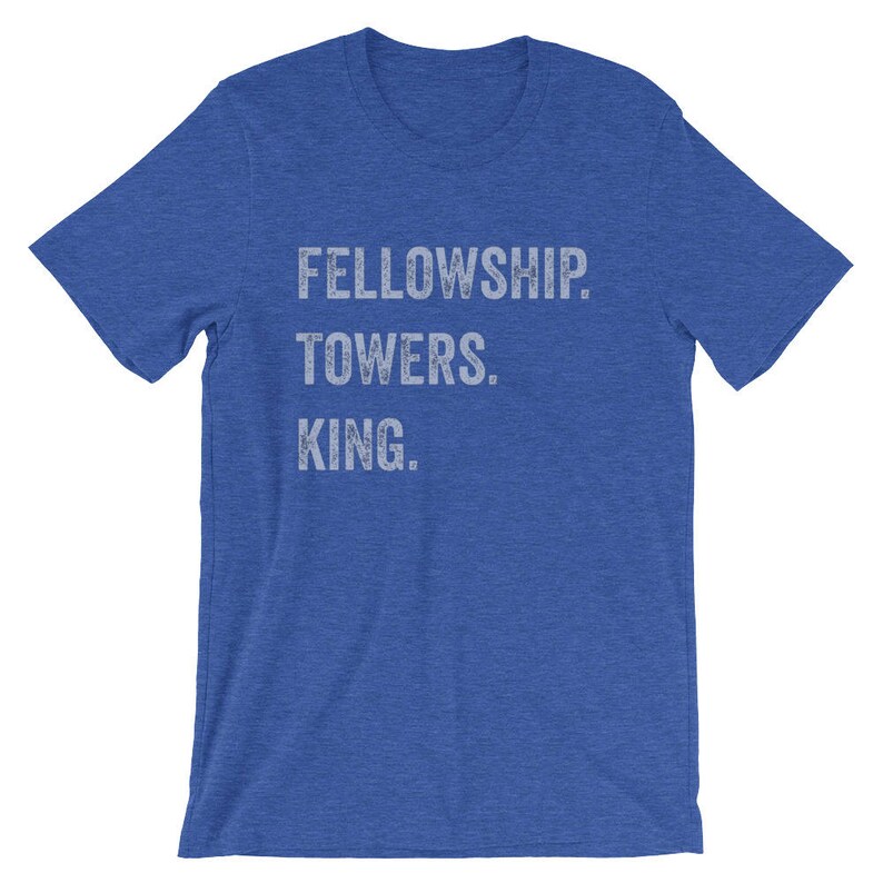 May include: A royal blue t-shirt with the text "FELLOWSHIP. TOWERS. KING." printed in white.