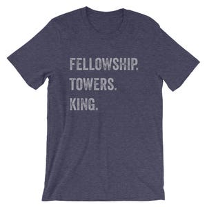 May include: A navy blue t-shirt with the text "FELLOWSHIP. TOWERS. KING." printed in white.