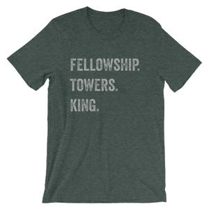 May include: A dark green t-shirt with the text "FELLOWSHIP. TOWERS. KING." printed in white.