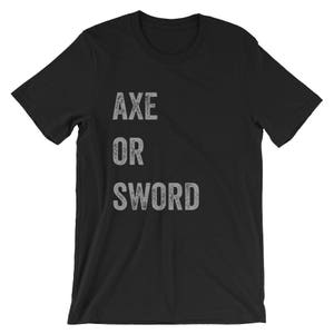 Puede incluir: Camiseta negra con el texto "AXE OR SWORD" impreso en una fuente gris desgastada.