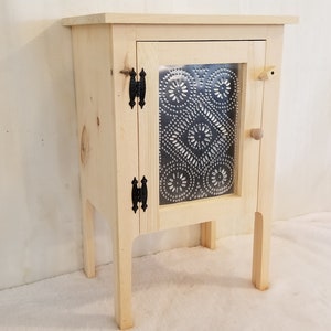 Unfinished Pine Night Stand w/tin Accent Door. Measures: 18 1/2" x 13 3/4" x 28 3/4" Tall.