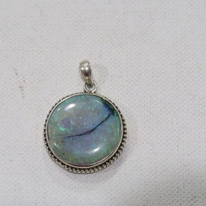 Sterling artisan Australian crystal opal circular pendant rope setting