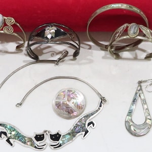 Vintage lot of alpaca jewelry with abalone, earrings, bracelets, necklace