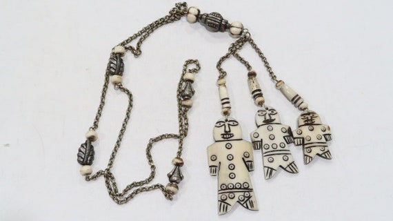Tribal carved bone figures and metal bead, bone bead lariat necklace