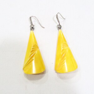 Vintage yellow carved bone pierced earrings Very unique