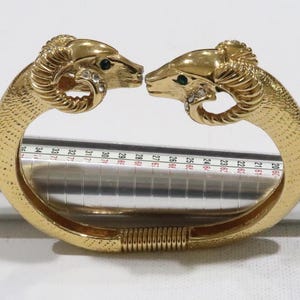 Stunning vintage KJL for Avon kissing ram head gold tone clamper bracelet