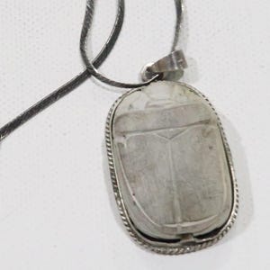 Vintage Egytian revival faience carved white scarab pendant set in sterling silver on a sterling chain